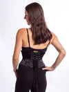 cute smiling model wearing the cs301 waspie corset in black cotton back lace up view