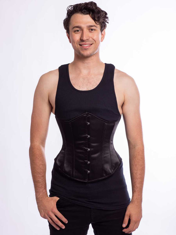 Male model wearing the cs 345 corset in black satin front busk view