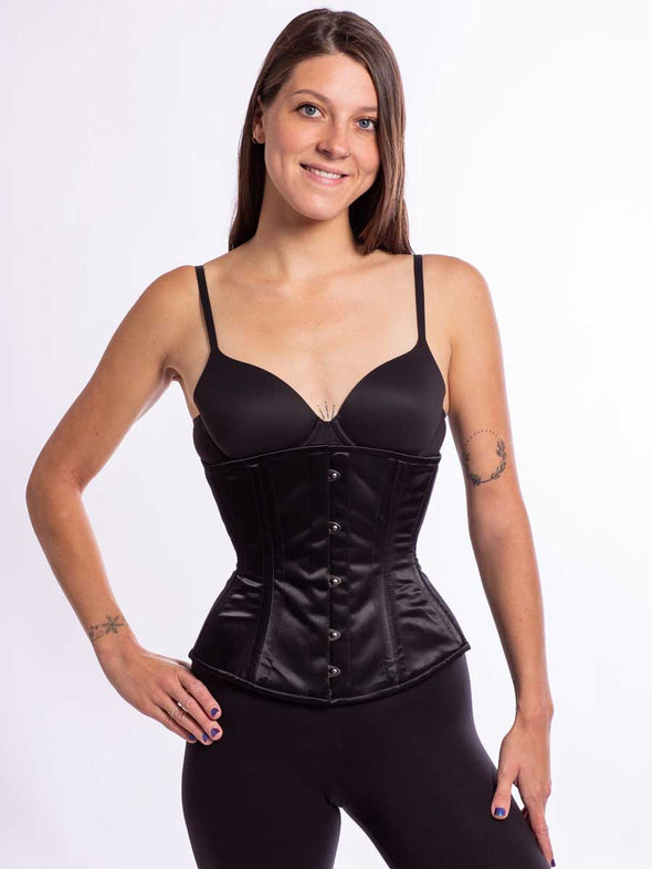 cute model wearing the cs 411 longline romantic curve corset in soft silky black satin