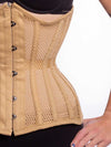 Front detail view of a Smiling model wearing black leggings and bra sporting a beige hourglass curve mesh corset