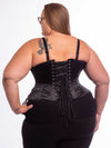 Curvy plus size model wearing black leggings and black bra with the black satin cs426 with hip ties showing the back lace up detail