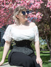 Model in a white shirt wearing our 479 black satin corset