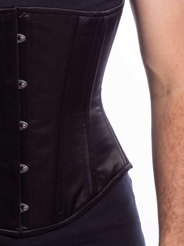 Cute male model wearing the modern curve cs701 in black satin Detail view