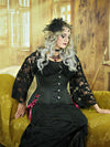 curvy model wearing the cs426 longline corset with hip ties with a black boho skirt and lace shirt