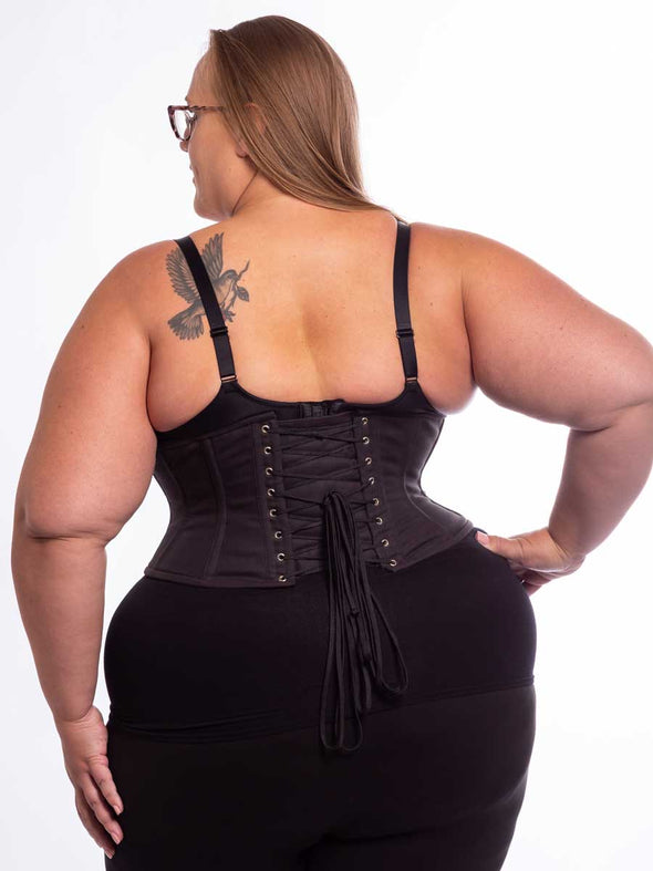 back lace up detail of a curvy plus size model in the 201 cotton waspie corset