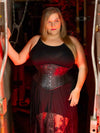 Curvy plus sized model wearing a black strappy dress and a leather cs-201 hourglass curve corset