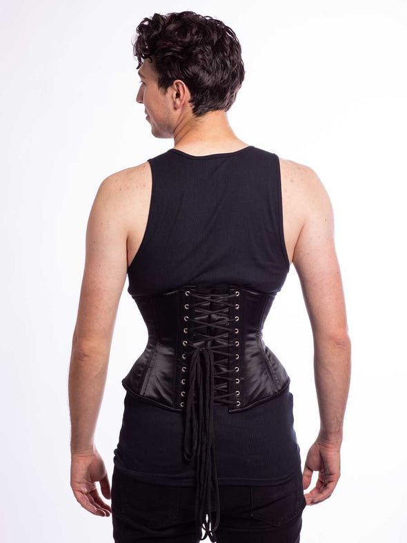 Male mMale model wearing the CS411 corset in design color black satin back lace up view