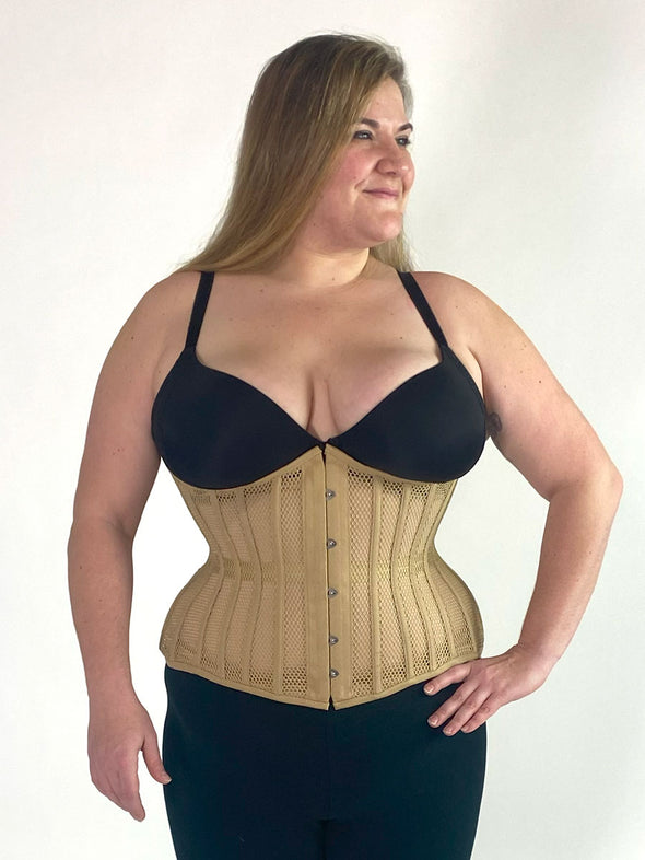 plus size curvy model wearing the 426 longline mesh waist training beige corset with a black bra and black leggings