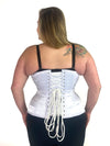 cute curvy corset model wearing a white satin corset over black leggings and black bra great for everyday wear fashion or waist training back lace up corset view