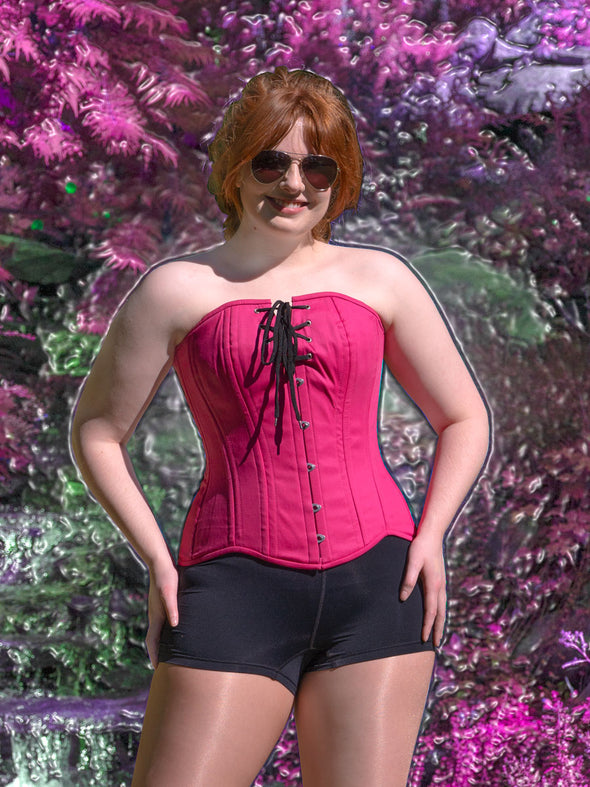front product picture of Travel to your favorite movie set with this limited edition Magenta Pink Cotton Hourglass Curve Longline Overbust Barbiecore Corset! Show off your signature magenta pink style and get ready to explore the PNW with the Adventure Dolls!