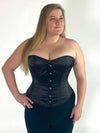 plus size corset model wearing a Orchard corset cs-530 overbust corset top in black satin with black leggings