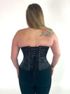 plus size corset model wearing a Orchard corset cs-530 overbust corset top in black satin with black leggings back laceup corset view