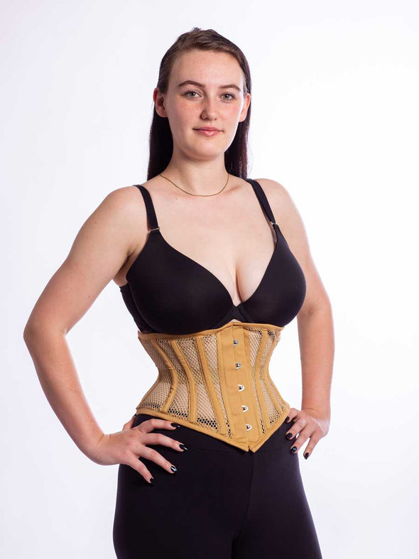 Model wearing black leggings and a black bra with the 201 beige mesh steel boned waist training corset  