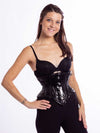 smiling model wearing the cs201 waspie corset in black pvc front view