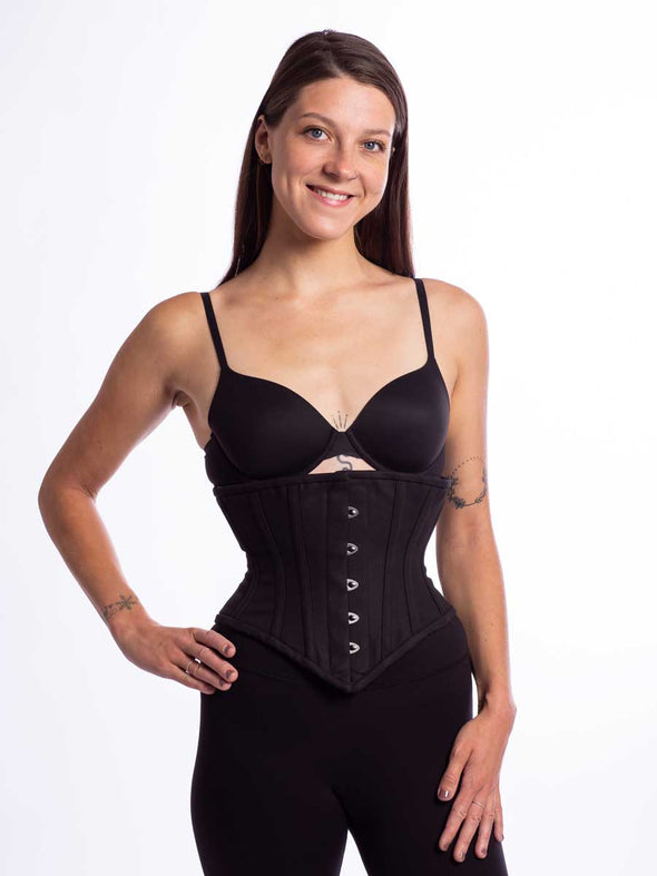 front view of a Cute model wearing the cs201 waspie corset in black Cotton