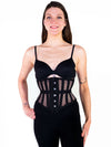 Cute model wearing the 201 hourglass curve black mesh over black leggings and a black bra