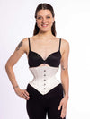cute corset model wearing a short ivory corset over a black bra and leggings