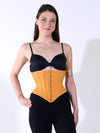 smiling model with long hair wearing black leggings and bra with a hourglass waspie corset to complete the outfit.