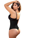 Model with long brown hair wearing the Vedette 211 Latex Firm Control Waist Cincher Thong Bodysuit Black side view