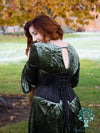 back lace up view of Model wearing the romantic curve cs-219 romantic curve black mesh waspie waist training corset over a green mini dress with burnout velvet scarf and gold locket