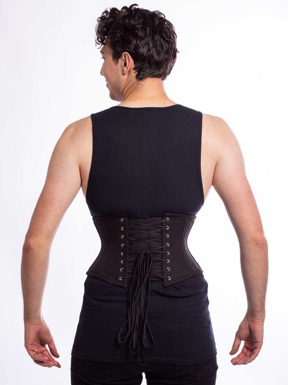 Male model wearing the cs 301 waspie corset in black cotton back lace up  view