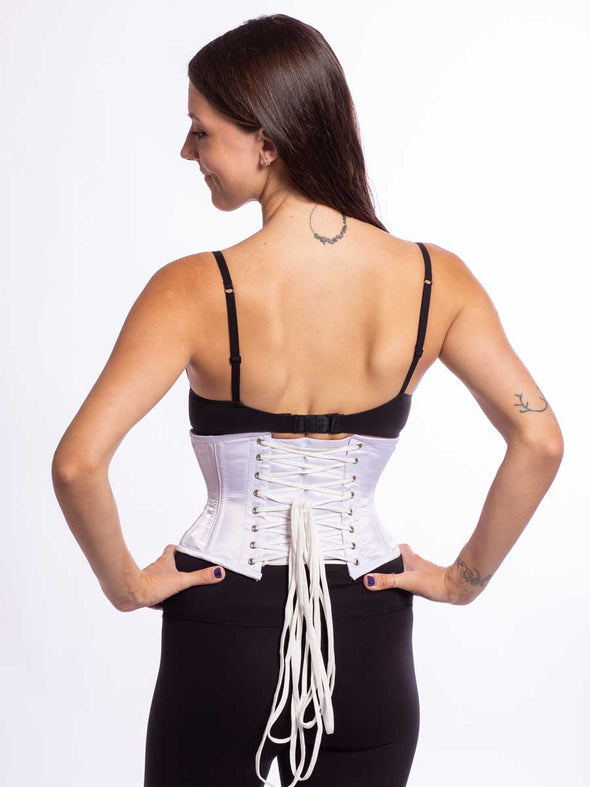 model wearing the new design cs 301 waspie corset in white satin back lace up view