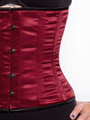 Front detail view of a Cute athletic build model wearing a modern curve corset in wine color with black leggings and black bra