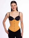 corset model wearing black tights and bra with a beige cotton everyday corset for fashion and waist training