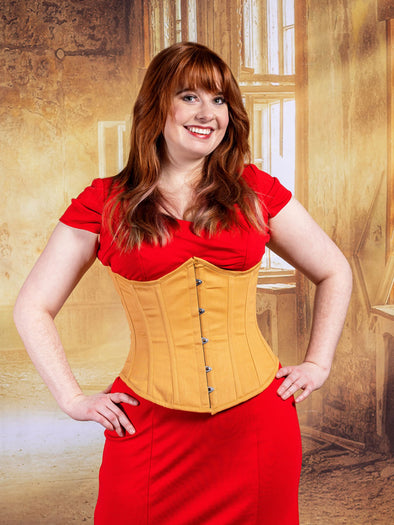 detail of cute corset model wearing a red bodycon dress with a beige mesh cs-345 romantic curve corset