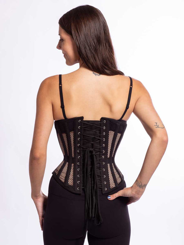 Smiling model wearing the cs 345 black mesh corset  back lace up view
