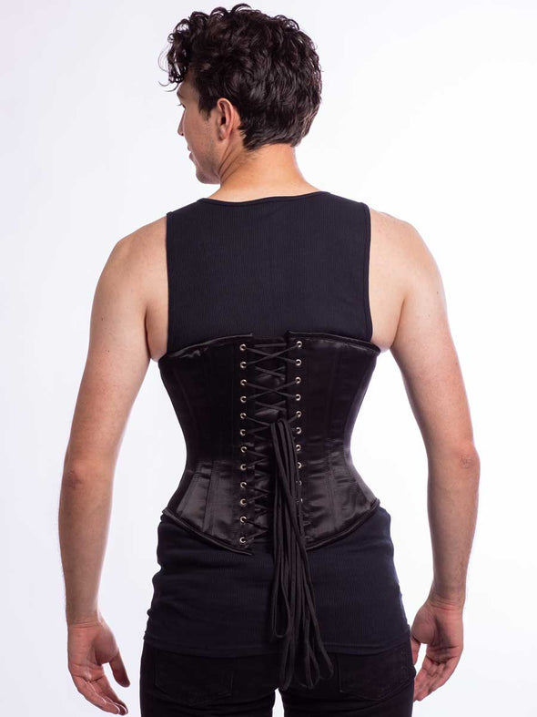 Male model wearing the cs 345 corset in black satin back lace up view