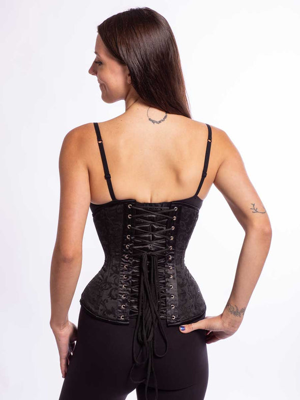 Model wearing the romantic curve cs 411 longline corset in a cute black brocade back lace up view