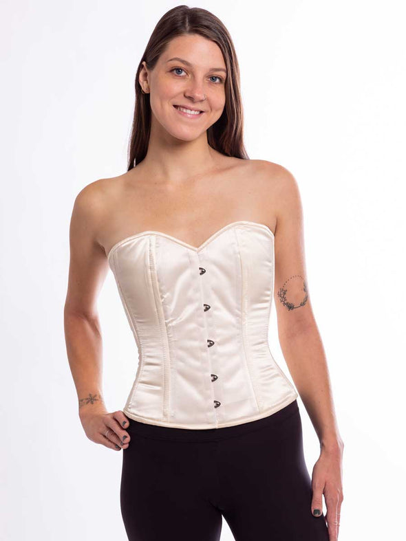 smiling model wearing the cs411 overbust corset top in ivory satin front view