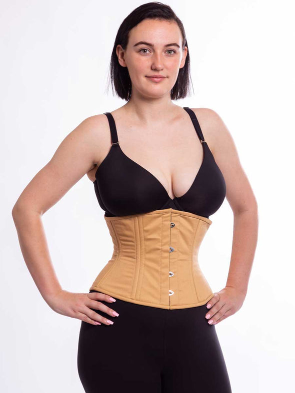 model wearing the beige cotton cs411 forward facing with hands on hips