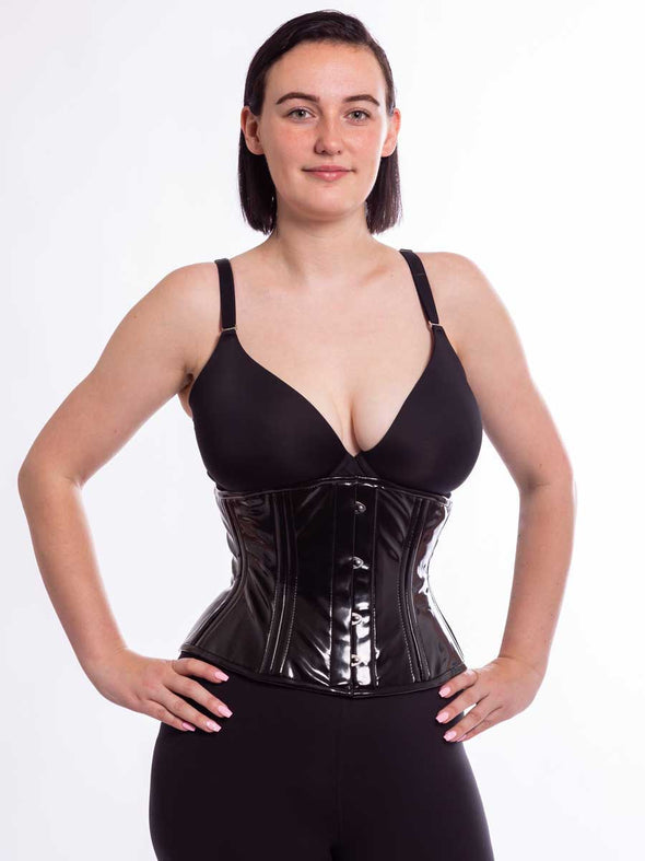 Black Shiny Latex PVC corset on cute model front facing hands on hips