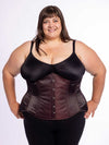 cute curvy plus size corset model wearing a shimmering maroon corset over a black bra and leggings