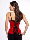 cute corset model wearing a black bra and black leggings over a red pvc latex corset back lace up corset view