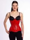 cute corset model wearing a black bra and black leggings over a red pvc latex corset