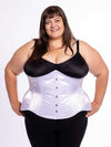 cute curvy corset model wearing a white satin corset over black leggings and black bra great for everyday wear fashion or waist training