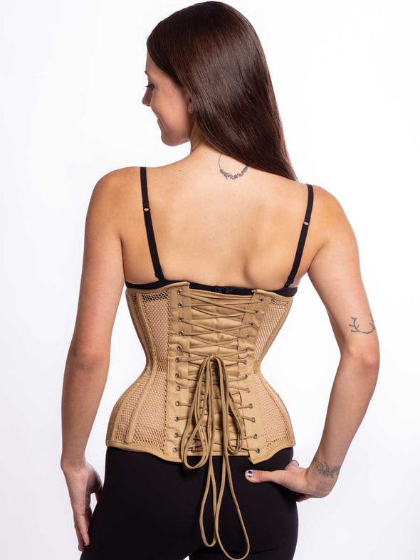 Back lace up view of a Smiling model wearing black leggings and bra sporting a beige hourglass curve mesh corset