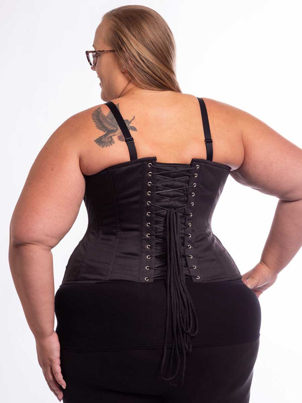 Plus size curvy model wearing a black cotton corset cs426 longline back lace up detail view