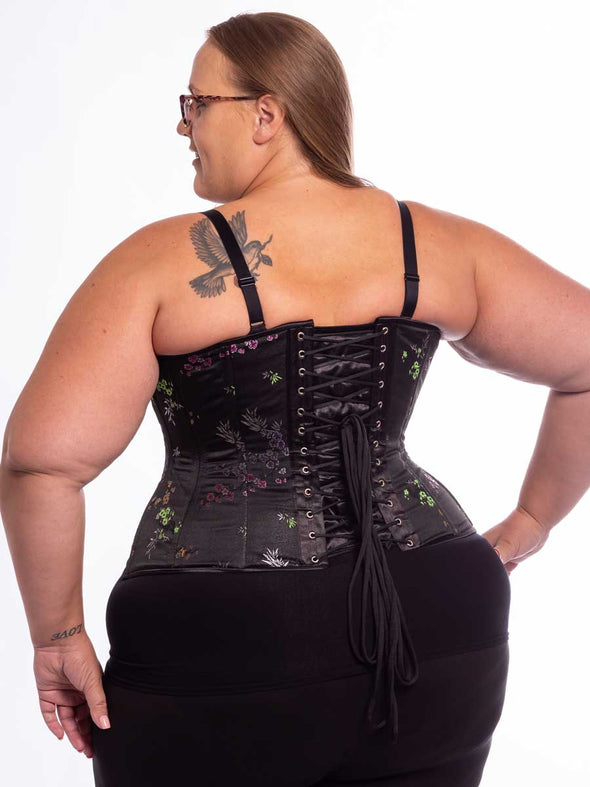 plus size curvy model wearing an Asian midnight floral brocade corset back lace up detail view