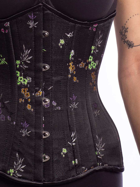 Cute model wearing the cs426 longline midnight brocade corset detail  view