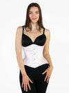 Smiling model wearing black leggings and a black bra completing the outfit with a pale pink hourglass curve satin corset