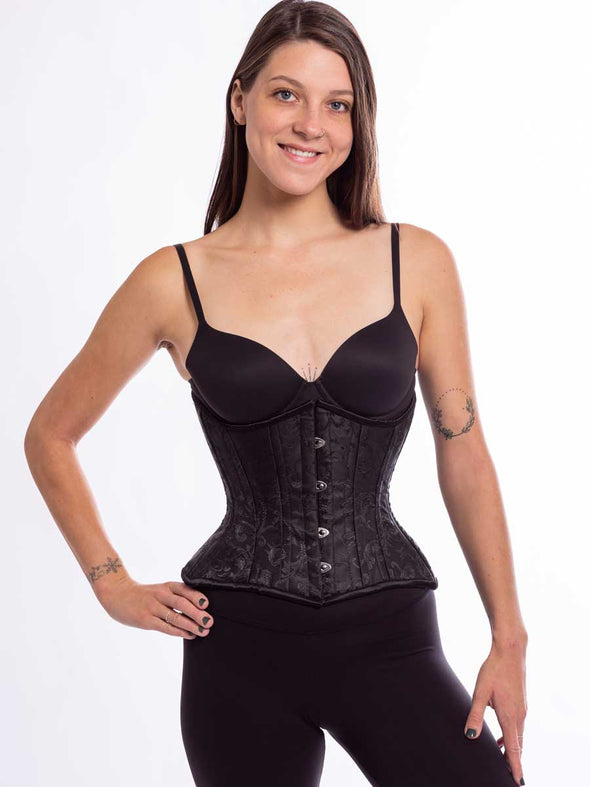 cute model wearing the hourglass curve cs426 corset in a fashionable  black brocade fabric