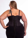 Curvy plus size model wearing the cs426 in black cotton with hip ties paired with black leggings and a black bra showing the back lace-up detail