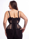 Smiling model wearing the extreme curve cs479 waist training corset in black mesh back lace up corset view