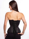 Cute model wearing a timeless black pinstripe corset top with black leggings back lace up view