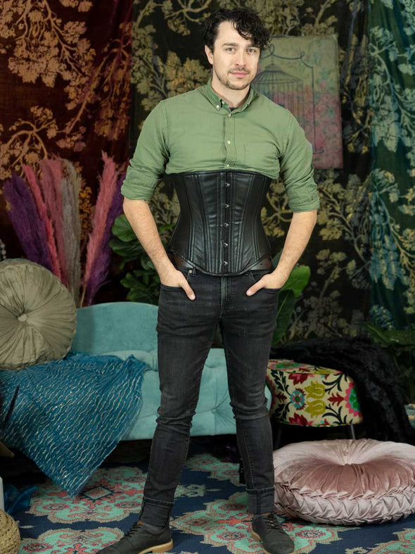 male model in jeans and a shirt wearing the black leather 701 corset