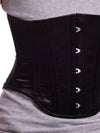 Detailed view of product shot of a Male corset model wearing the black satin modern curve cs-701 waist training corset with dark jeans and a t shirt
